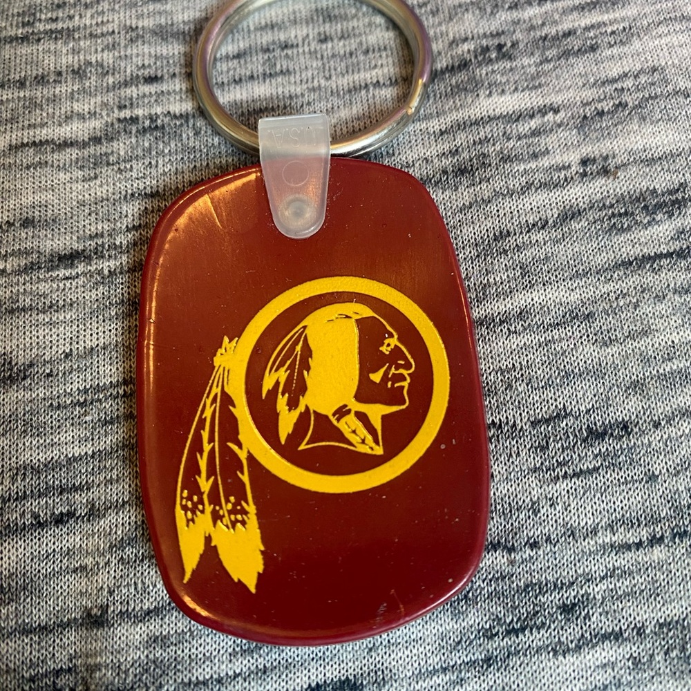 Red Keychain with Yellow Emblem